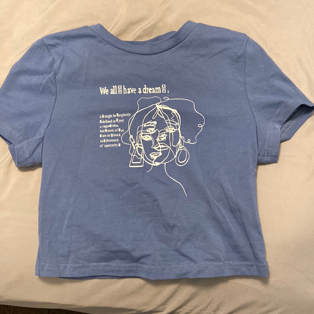 blue crop tee with writing on it